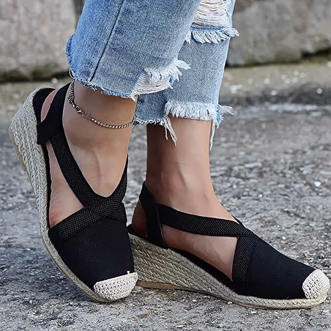Dutyrole lifestyle collection featuring premium wedge espadrille sandals and accessories against a clean modern background